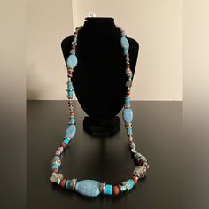 Macy’s Beaded Necklace With Turquoise, Red, And Silver Colored Beads I Have Lots Of Jewelry Listed, So Feel Free To Create A Bundle And Pay Only A $7.67 Flat Rate (For Up To 5 Lbs), Plus Take Advantage Of Bundle Pricing! Reasonable Offers Are Also Welcome. If You Like (Click Heart Sign On) Multiple Items, I Will Make Them Into A Bundle For You And Offer A Discount. New To Poshmark? Use This Link (Https://Posh.Mk/Vrvp72vgzab) Or The Referral Code (Me_and_mommy) To Save $10 On Your First Purchase. Blue Hand-strung Long Necklace, Blue Long Hand-strung Necklace, Artisan Hand-strung Blue Beaded Necklace, Southwestern Style Blue Beaded Necklace For Beach, Bohemian Large Blue Beads, Blue Gemstone Beaded Necklaces In Southwestern Style, Blue Long Beaded Necklace With Polished Beads, Artisan Blue Turquoise Necklace With Colorful Beads, Bohemian Blue Gemstone Bead Necklaces