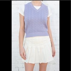 Classic Cable-Knit Sweater Vest With A High V-Neck. Fabrics: 100% Cotton Measurements: 19" (48 Cm) Length, 16" (41 Cm) Bust Made In: Italy Preppy Spring Knit Tops, Spring Preppy Knit Tops, Preppy Knit Tops For Spring, Spring Preppy Cotton Sweater, Preppy Cotton V-neck Sweater, Cotton Cable Knit V-neck Sweater Vest, Trendy V-neck Cable Knit Sweater Vest, Cotton V-neck Sweater Vest For Fall, Casual Fitted Cotton V-neck Sweater