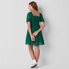 This Thereabouts little and big girls' dress boasts a smocked bodice that offers a comfortable fit and an A-line silhouette making it ideal for twirling. Made from lightweight georgette, it also features a square neck, short puffed sleeves, and a knee-length. Style it with sneakers for a cute and casual outfit. Closure Type: Pullover HeadNeckline: Square NeckSleeve Length: Short SleeveDress Length: Knee LengthFiber Content: 100% PolyesterFabric Description: GeorgetteCare: Machine Wash, Tumble D… Spring A-line Smocked Dress With Smocked Bodice, Casual A-line Mini Dress With Smocked Bodice, Casual Green Smocked Dress With Square Neck, Fitted Knee-length Casual Smocked Dress, Casual Green Mini Length Smocked Dress, Casual Green Mini Smocked Dress, Casual Fitted Knee-length Smocked Dress, Casual Knee-length Fitted Smocked Dress, Spring A-line Smocked Dress