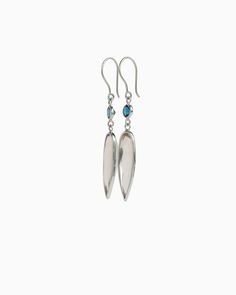 Vibe's beautifully handcrafted Ellipse Stone Drop Earrings are a stunning pair of earrings to add to your collection. These elegant earrings are handcrafted from sterling silver and featuring a round faceted london blue topaz and ellipse shaped faceted citrine. Metal: Sterling silver Stone: London blue topaz, citrine Measurements: 53mm x 10mm Style #: E206LbC Elegant Sterling Silver Gemstone Linear Earrings, Long Drop Gemstone Sterling Silver Earrings, Sterling Silver Long Drop Jewelry With Polished Finish, Long Drop Gemstone Earrings In Sterling Silver, Oval Sterling Silver Earrings With Polished Finish, Sterling Silver Linear Earrings Fine Jewelry, Artisan Polished Earrings For Gift, Teardrop Blue Topaz Earrings, Sterling Silver Linear Drop Earrings With Gemstone