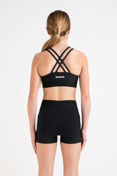 The Base Crop Top in Black is designed for maximum functionality as a staple for any activity. The round neckline shape features elasticised dual criss-cross straps for added support and structure. The Base Crop Top features a full front lining cut in a neoprene fabrication for complete comfort and additional coverage. The hemband is finished with a signature Every Turn branded elastic that has an incredible stretch, so there is no slipping during training. Strappy Back Stretch Sports Bra For Training, Training Sports Bra With Strappy Back And Stretch, Stretch Training Sports Bra With Strappy Back, Stretch Strappy Sports Bra With Built-in Padding, Stretch Activewear With Adjustable Straps And Strappy Back, Stretch Activewear With Adjustable Cross-back Straps, Adjustable Straps Cross Back Activewear, Sporty Activewear With Light Support And Crisscross Design, Sporty Crisscross Activewear With Light Support