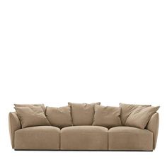 a beige couch with pillows on it