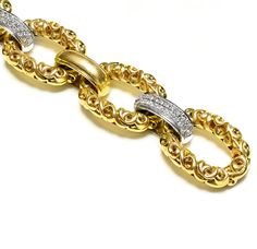 Krypell Gold Diamond Heavy Wide Link Bracelet This Charles Krypell bracelet showcases an elegant composition of ornate 18K yellow gold, crafted with precision to form a series of sumptuous links that catch the light with every movement. This piece is a striking example of craftsmanship and luxury, perfect for enhancing any ensemble with a rich, opulent touch. Whether worn as a statement piece or paired with other fine jewelry, it promises to be a captivating addition to any collection. Bracelet weighs 97.6 gramsand it fits up to a 6.5 inches wrist. Signed C Krypell 18K. Luxury Diamond Chain Bracelet With Rectangular Links, Luxury Ornate Collectible Bracelets, Luxury Chain Link Bracelets With Box Clasp, Luxury Yellow Gold Ornate Bracelets, Luxury Statement Diamond Bracelet In Yellow Gold, Luxury Yellow Gold Ornate Bracelet, Luxury Hallmarked Vintage Chain Bracelet, Luxury Statement Yellow Gold Diamond Bracelet, Luxury Antique Yellow Gold Chain Bracelet