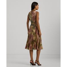 Crafted with foiled chiffon for a lustrous metallic sheen and a lightweight feel this sleeveless cocktail dress showcases the season’s abstract floral motif which is reminiscent of ikat weaving techniques. A self-belt at the waist enhances this style’s fit-and-flare silhouette while a sunburst-pleated skirt creates effortless movement with each step. Elegant Sleeveless Dress With Floral Print For Cocktail, Elegant Silk Sleeveless Dress With Floral Print, Ralph Lauren Sleeveless Midi Dress, Chic Ralph Lauren Midi Dress For Summer, Chic Ralph Lauren Summer Midi Dress, Ralph Lauren Sleeveless Dress, Elegant Ralph Lauren Cocktail Dress, Ralph Lauren Summer Knee-length Dresses, Ralph Lauren Knee-length Summer Dresses