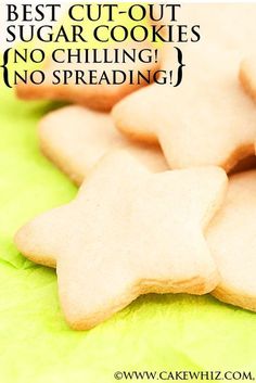 some cut out sugar cookies sitting on top of a green napkin with the words best cut - out sugar cookies no chilling, no spreading