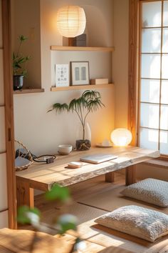 a room that has some plants on the table and pillows in front of it,