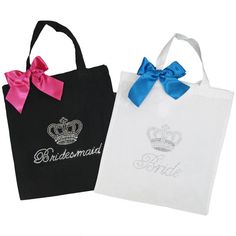 two black and white shopping bags with pink bows on the handles, one is for bridesmaids