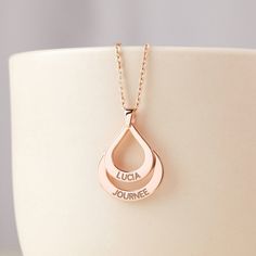 The most special and most favorite gifts for mothers and grandmothers alike. Select 1-3 rings, each engraved with name of her children or grandchildren. This 3-heart necklace can hold up to 6 children's names. ► MOM RINGS NECKLACE * Material: High Quality Solid 925 Sterling Silver * Finishing: Silver, 18k Gold or Rose Gold. * WORD LIMIT: Smallest ring: 1 words / Medium ring: 2 words / Largest ring: 3 words. Date is counted as 2 words. * All of our jewelry are handmade from scratch and packaged w Mother's Day Anniversary Name Necklace With Hallmarks, Mother's Day Personalized Name Necklace With Hallmarks, Mother's Day Necklace With Engraved Text, Engraved Name Necklace For Anniversary On Mother's Day, Rose Gold Name Necklace With Hallmark For Personalized Gift, Personalized Rose Gold Name Necklace With Hallmark, Engraved Necklace For Mother's Day Anniversary, Personalized Teardrop Necklaces For Mother's Day, Personalized Teardrop Necklace For Mother's Day