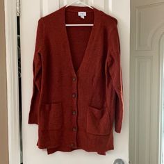 This Rust Colored Button Up Cardigan From Old Navy Has Been Washed But Never Worn - It’s In Excellent Condition. It’s A Size Small With Two From Pockets And Button Closures. It Has A V Neckline. Measurements (Approximations): - 29 Inches From Shoulder To Hem - 25 Inches From Shoulder To Cuff - 20.5 Inches Across When Laid Flat *No Trades Red Button-up Cardigan With Buttons, Fall Red Buttoned Cardigan, Red Button-up Cardigan With Button Closure, Red Button Cardigan For Fall, Red Button-up Cardigan, Red Buttoned Cardigan For Fall, Red Buttoned Cardigan For Work, Red Button-up Cardigan For Fall, Oversized Sweater Coat