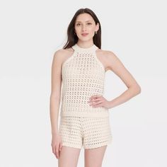 Women's Openwork Halter Crewneck Sweater Tank - Universal Thread™ Cream Xs : Target Beige Sleeveless Top For Beach Season, Sleeveless Knit Top For Beach, Stretch Knit Sleeveless Halter Top, Sleeveless Knit Stretch Halter Top, Stretch Knit Halter Neck Top For Spring, White Pointelle Knit Tank Top For Spring, Sleeveless Stretch Knit Halter Top, Spring Halter Neck Knit Top, Beige Sleeveless Trendy Halter Top