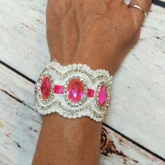 Eye Catching Hot Pink Rhinestone Cuff Bracelet. Made Of White Lace And Lined With White Satin Ribbon And Ties With Hot Pink Satin Ribbon. It Is Embellished With Hot Pink Rhinestone Brooches And Trimmed With Clear Rhinestones. Measures 6" Long And Is 1 3/4" Wide. It Has Satin Ribbon Adjustable Ties To Fit Most Wrists. White Rhinestone Bracelets For Party, White Party Bracelets With Rhinestones, White Crystal Bracelet For Party, Rhinestone Cuff Bracelet For Wedding, Crystal Rhinestone Cuff Bracelet For Wedding, Crystal Cuff Bracelet With Rhinestones For Wedding, Adjustable Rhinestone Cuff Bracelet For Weddings, White Crystal Bracelet With Rhinestones For Party, White Rhinestone Crystal Bracelet For Party