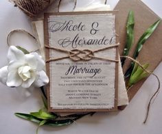 an image of wedding card with flowers and twine