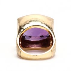 Surprise your February birthday baby (or treat yourself) with this gorgeous ring! This exquisite 18 karat solid yellow gold ring is bezel-set with one checkerboard cushion cut amethyst measuring approximately 17.87 millimeters long by 15.34 millimeters wide and weighing an estimated 11.59 carats. This ring is a size 6 3/4 and can be re-sized to fit by your local jeweler. It measures 18.02 millimeters wide at the top and tapers to 3.33 millimeters wide at the shank. The top of the stone sits an i Luxury Faceted Amethyst Ring For Formal Occasions, Luxury Faceted Amethyst Ring For Formal Events, Formal Yellow Gold Amethyst Ring With Bezel Setting, Yellow Gold Amethyst Ring Stamped 14k, Collectible Yellow Gold Amethyst Ring Stamped 14k, Collectible 14k Yellow Gold Amethyst Ring, Formal Faceted Amethyst Ring Fine Jewelry, Formal Yellow Gold Amethyst Ring With Polished Finish, Faceted Amethyst Ring In Yellow Gold Fine Jewelry