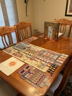 a wooden table topped with lots of cards