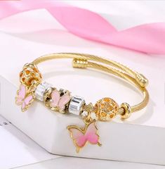 Butterfly Charm Bracelet - Pink Trendy Butterfly Jewelry For Gift, Trendy Pink Metal Bracelet, Trendy Pink Jewelry With Charms, Trendy Pink Metal Bracelets, Pink Metal Bracelets For Gifts, Pink Metal Bracelets With Charms, Butterfly Charm Bracelet Jewelry Gift, Pink Metal Bracelet With Charms, Pink Metal Charm Bracelet As A Gift