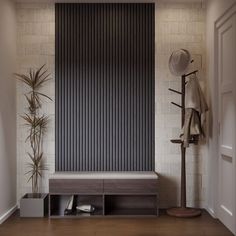 an empty room with a bench, coat rack and potted plant