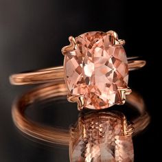 This exquisite and stunning ring is one you might see walking down the red carpet. She will be swept away with its simple but elegant tulip design and setting perfectly featuring a generous, feminine peachy-pink Morganite stone. Sure to catch all eyes, this is that ring that truly cannot be ignored! Morganite Rose Gold Ring, Rose Gold Morganite Ring, Rose Gold Morganite, Morganite Engagement, Pink Morganite, Morganite Engagement Ring, Rose Gold Band, Morganite Ring, Creating Jewelry