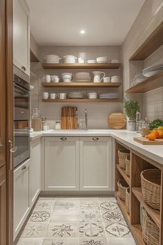 a kitchen filled with lots of white cupboards