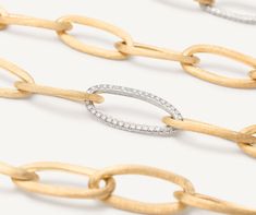 This bold and elegant long necklace features a balanced play of full and empty volumes. The chain is made up of oval elements in 18K yellow gold, finely hand-engraved using the ancient Florentine technique which gives our gold a fine, brushed texture. The necklace is further embellished with three pavé links of brilliant-cut diamonds. Sara Sampaio, The Chain, The Ultimate Gift, Gold Collection, Diamond Sizes, High Jewelry, Link Necklace, Hand Engraving, Brilliant Cut Diamond