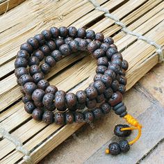 Discover the harmonious blend of spirituality and protection with our stunning Natural Antique 108 Dark Aged Rudraksha Mala Rosary. Handcrafted with love and care, this 108-bead rosary brings together the spiritual essence of Hindu and Buddhist traditions ❤Product Details:  Great Mala For Meditation and Yoga Practitioners  Well Strung on macrame cotton thread   Beads are approximately 8-9mm and Malas is around 32-34 Inches Long ❤ Natural Dark Rudraksha Beads: Each bead is carefully selected for its rich color and natural texture, providing a tactile and visual connection to the Earth's energy Beads are naturally stained and oiled to achieve their beautiful dark color and aged appearance.  ❤Spiritual Significance: The 108 beads in this rosary hold deep spiritual significance, traditionally Brown Spiritual Beads For Meditation, Spiritual Wooden Beads Mala For Meditation, Spiritual Wooden Beads Jewelry For Meditation, Spiritual Round Beads Bracelets For Meditation, Handmade Spiritual Beaded Bracelets For Meditation, Spiritual Brown Beaded Bracelets For Rituals, Spiritual Brown Beaded Bracelets, Holistic Healing Mala With Wooden Beads, Spiritual Wooden Beaded Healing Bracelets