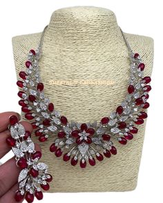 CZ Red Stone Silver Finish Neckline Short Necklace, Cubic Zirconia Necklace Earrings Length : 2.75 Inches Ruby Necklaces With Sparkling Stones For Party, Party Ruby Necklaces With Sparkling Stones, Party Ruby Necklace With Sparkling Stones, Red Diamond Jewelry With Sparkling Stones, Elegant Red Rhinestone Necklaces, Dazzling Red Necklaces With Sparkling Stones, Red Necklaces With Sparkling Stones For Formal Occasions, Red Cubic Zirconia Jewelry With Stones, Red Necklace With Sparkling Stones For Formal Occasions