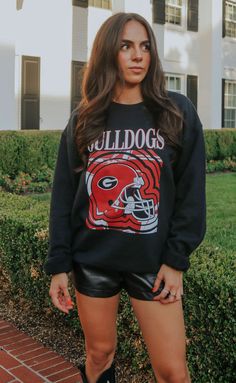 Gameday but make it a band tee inspired! This black sweatshirt features a rocking Georgia helmet and groovy design. Wear it to the cooler end of season games with black leather shorts and tall boots. WE ONLY OFFER STORE CREDIT FOR RETURNS! Feel free to email us at orders@shopriffraff.com or DM us with any questions regarding fit, styling, or our return policy in general. Nirvana Band, Groovy Design, Black Leather Shorts, Pug Shirt, Red Boots, Black Sweatshirt, Football Game, Leather Shorts, Blue T