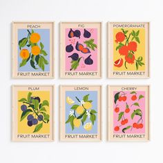 four fruit market posters are displayed on a wall