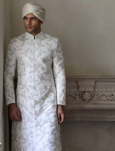 Traditional White Bandhgala For Wedding, White Nehru Jacket With Chikankari Embroidery For Groom, White Traditional Wear With Resham Embroidery For Groom, White Chikankari Nehru Jacket For Groom, White Chikankari Embroidery Nehru Jacket For Groom, White Resham Embroidery Traditional Wear For Groom, White Nehru Jacket For Groom With Traditional Drape, White Nehru Jacket With Traditional Drape For Groom, White Nehru Jacket With Zari Work For Groom