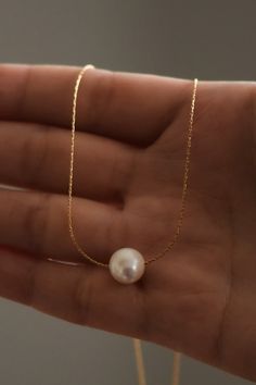 Dainty and minimal, pearl necklace. Designed with the skinniest chain that creates a modern and simple statement. This single necklace is tarnish free and meant to last with the proper love and care. Gold dipped chain and shiny, rounded, pearl. Pearl Necklace Outfit, Single Necklace, Single Pearl Necklace, Necklace Outfit, Simple Pearl, Quotes Instagram, Set Outfits, Gold Pearl Necklace, Sunset Quotes