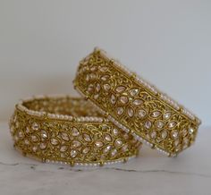 The Premium quality Antique gold finish handcrafted high-quality reverse Polki bangles with beaded pearl on edge. Non-openable style. Size: 2.4, 2.6 & 2.8 Comes 2 in a set. Antique gold finish. *Color may vary slightly due to light condition & photography. Jewelry Care: Keep away from moisture. Allow perfumes and lotion to dry before wearing. Store in jewelry pouch. Clean only with soft lint free cloth. Gold Bangle Indian, Kundan Bracelet, Polki Bangles, Gold Bangles Indian, Photography Jewelry, Jewelry Pakistani, Bangles Indian, Pakistani Jewelry, Gold Bangle