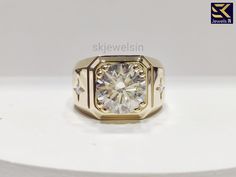 14K Gold Round Moissanite Ring For Men, Unique Solitaire Three Stone Diamond Ring For Him, Statement Ring, Gift For Men, Handmade Jewelry ✦ Center Stone Details: ◈ Shape: Round Cut Diamond ◈ Weight:2.50 CT ◈ Diamond Size : 8.50 MM ◈ Diamond: Moissanite  ◈ Color: Colorless ◈ Clarity: VVS ◈ Luster : Excellent ◈ Make: High Quality ✦ Side Stone Details: ◈ Shape: Round Diamond ◈ Weight: .20 CT ◈ Diamond: Moissanite  ◈ Color: Colorless ◈ Clarity: VVS ◈ Luster: Excellent ◈ Make: High Quality ✦ Ring Det Three Stone Diamond Ring, Stone Diamond Ring, Three Stone Diamond, Ring For Men, Round Moissanite, Moissanite Ring, Moissanite Rings, Diamond Sizes, Moissanite Diamonds