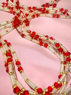 Introducing "Touih" – a Single Strand Waist Bead that exudes a mesmerizing glow with its ethereal white glow-in-the-dark glass beads, accompanied by the passionate allure of red crystal glass seed beads and the subtle elegance of gold glass seed beads. 🌟 Luminescent Elegance: Touih captures attention with its enchanting white glow-in-the-dark glass beads, adding a touch of mystique to your style. Whether in daylight or under the stars, this waist bead radiates an alluring luminosity. 🌹 Passion Strong Hand, Subtle Elegance, Waist Beads, Ethereal Beauty, Glass Seed Beads, Gold Gilding, Gold Glass, Red Crystals, Red Accents