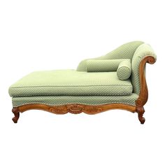 an old fashioned chaise lounge with green upholstered fabric