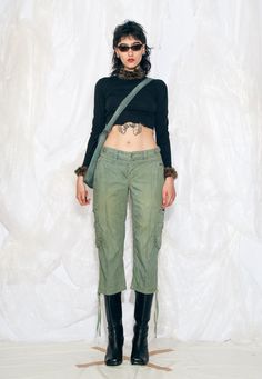 These Y2K vintage trousers are a sporty coquette dream come true with their low waist and cargo style. We overdyed them to get this nice moss green colour. Recommended size: EU 36-38 Features: - eight pockets - zip closure - reworked Every item we manage is cleaned and, when necessary, repaired, ensuring it arrives to you in top condition. Our model, Noemi is 177 cm / 69.0" tall and she's a size S. Size: S / US 4 / UK 8 / IT 40 Measurements:  waist (seam to seam): 40 cm / 15.6" rise: 21 cm / 8.2" inseam length: 55 cm / 21.5" Care: Machine wash separately Y2k Wide Leg Green Cargo Pants, Y2k Green Wide Leg Cargo Pants, Y2k Style Green Cargo Pants For Streetwear, Y2k Green Cargo Pants For Streetwear, Green Y2k Cargo Pants For Streetwear, Y2k Green Bottoms With Cargo Pockets, Y2k Green Cargo Bottoms, Y2k Style Straight Leg Cargo Parachute Pants, Y2k Straight Leg Parachute Cargo Pants