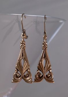 Antiqued Brass Art Deco style earrings with lever back ear wires. Just under 2 inches long. All orders come in a gift box or gift bag. Classic Pierced Chandelier Earrings For Formal Occasions, Classic Antique Gold Metal Jewelry, Ornate Dangle Chandelier Earrings For Formal Occasion, Formal Ornate Dangle Chandelier Earrings, Antique Pierced Earrings For Anniversary, Classic Filigree Earrings, Victorian Earrings For Evening, Victorian Chandelier Dangle Earrings For Formal Occasions, Antique Evening Earrings For Pierced Ears