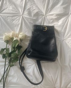 Stunning vintage 1990's black Coach leather backpack, made in USA quality. Such a classic petite backpack and favorite designer find. Featuring solid brass accents and most supple leather. Measures 7in x 4.25in x 9.5in. In stunning vintage condition with very minor vintage wear. Corners and interior are in beautiful condition. Has been freshly cleaned and conditioned. Classic Leather Backpack With Gold-tone Hardware, Classic Satchel Backpack With Gold-tone Hardware, Classic Leather Satchel Backpack With Gold-tone Hardware, Classic Black Backpack With Gold-tone Hardware, Classic Leather Backpack With Gold-tone Hardware For Daily Use, Vintage Black Satchel Backpack, Classic Backpack With Gold-tone Hardware For Everyday Use, Black Vintage Satchel Backpack, Classic Everyday Backpack With Gold-tone Hardware