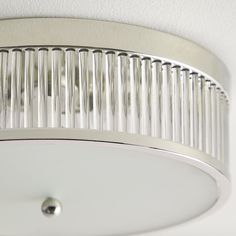 a close up of a light fixture on a ceiling