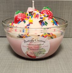 a bowl filled with cake and sprinkles on top of a gray surface