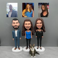 three custom bobble heads sitting next to each other