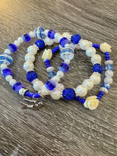 Elevate your style with our Zeta Phi Beta Bracelet Stack, a stunning tribute to the illustrious sisterhood. This elegant stack features a blend of rich blue and white beads, symbolizing the timeless colors of Zeta Phi Beta. Each bracelet is meticulously crafted to ensure a perfect fit and comfortable wear. The standout piece is a delicate dove charm, representing peace, love, and the enduring spirit of our sorority. Wear this bracelet stack with pride and let it be a beautiful reminder of your c Zeta Phi Beta Bracelets, Zeta Phi Beta Painting, Zeta Phi Beta Svg, Zeta Phi Beta Tumbler, Zeta Phi Beta Sweatshirt, Zeta Phi Beta, White Beads, Peace Love, Bracelet Stack