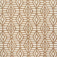 an intricate pattern is shown on the side of a wooden paneled wall in white and beige