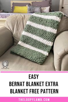 a crocheted blanket sitting on top of a couch with text overlay reading easy bernat blanket extra blanket free pattern