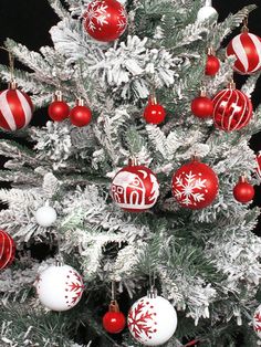 a christmas tree with red and white ornaments