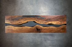 a piece of wood that has been carved to look like waves on the surface of water