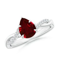 a white gold ring with a red stone and diamonds