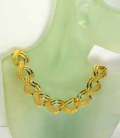 This stunning gold_plated multi chain collar necklace looks like a piece of fine Byzantine jewelry owing to the rich gold-plated metal setting.  The length of this piece of jewelry is almost 16.5" long and 5/8" wide. It weighs 2  oz. The necklace fastens with a flip over clasp.  Condition is excellent with no obvious damage or wear. This is a gorgeous marked Napier  Pat Pend  4.774.743. Vintage piece from 1980's. We combine shipping.   Thank You for visiting our Etsy https://www.etsy.com/shop/Vi Gold-tone Jewelry With Gold Chain For Jewelry Making, Gold Metal Jewelry With Chain Detail, Gold Metal Chain Jewelry, Gold Chain Metal Jewelry, Gold Clavicle Chain Link Necklace, Elegant Gold Chain Link Necklace, Gold Multi-strand Jewelry For Party, Gold-plated Chain Link Jewelry, Gold-tone Plated Metal Chain Necklace