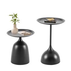 two tables with black bases and a white vase on one side, each holding a plant