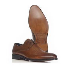 A sophisticated 3-hole derby with a unique perforated upper featuring the Mariano logo engraving.  Fine calf leather Handmade leather sole Option: Anti Slip Sole Material: Leather  Care intructions: Take good care of your shoes and they should do you proud for many years. Shoes should be put on using a shoe horn. Avoid wearing the same shoes on consecutive days since the moisture absorbed by the leather takes at least 24 hours to dry out. For storage, insert a shoe tree to avoid deformation of t Business Lace-up Shoes With Round Toe And Perforations, Business Oxfords With Perforated Plain Toe, Leather Oxfords With Perforated Toe Box For Business, Leather Oxfords With Perforated Toe Box For Semi-formal Occasions, Business Oxfords With Perforated Toe Box, Business Oxfords With Perforations And Round Toe, Luxury Business Dress Shoes With Perforated Toe Box, Brown Oxfords With Perforated Toe For Business Casual, Wingtip Dress Shoes With Perforations For Business