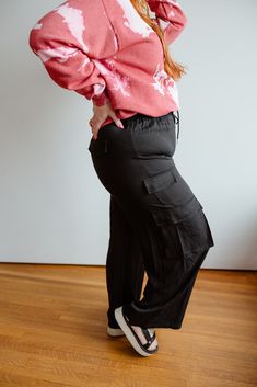 Get ready to flow like never before in our FLOWY WIDE LEG CARGO PANTS. These high-waisted, solid tencel pants feature an elastic waist with adjustable drawstrings for ultimate comfort. With pockets for convenience, these pants are the perfect combination of relaxed and on-trend. Fits true to size. We suggest going with your typical size. Pants have little stretch in the leg and butt. Leah is wearing a size 1x. Want more information about the model? Visit our Lovely Models page. Wash Hand wash co Versatile Rayon Bottoms With Pockets, Relaxed Fit Rayon Bottoms With Pockets, Relaxed Fit High Waist Rayon Bottoms, High Waist Relaxed Fit Rayon Bottoms, High Waist Rayon Bottoms With Relaxed Fit, Casual Rayon Bottoms For Fall, Versatile Rayon Pants With Pockets, Elevated Casual Straight Cargo Pants With Elastic Waistband, Fall Cargo Pants With Elastic Waistband For Loungewear