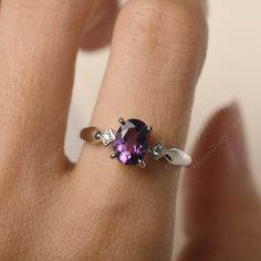 All HANDMADE ITEMS SHIP IN APPROX 8 DAYS Main Stone: Real natural amethyst Main Stone Size: Oval cut 6 mm x 8 mm Main Stone Weight: 1.19 carat Side Stone: CZ Height From The Ring Setting Bottom(to gemstone top): about 5.24 mm Width of Ring band Measure: gradually varied,about 2.14 to 2.99 mm Material: 925 Sterling Silver/14K White Gold/14K Yellow Gold/14k Rose Gold Engraved: Available For FreeNo more than 13 letters) Customized:Of course! Tell me what you want Includes With Order: All of my stor Amethyst Birthstone Ring With Accent Stones For Promise, Amethyst Birthstone Ring With Center Stone In White Gold, White Gold Amethyst Birthstone Ring With Center Stone, Dainty Amethyst Gemstone Ring For Anniversary, Dainty Amethyst Ring As Birthstone, Purple Birthstone Ring With Accent Stones For Promise, Amethyst Gemstone Birthstone Ring For Promise, Purple Dainty Birthstone Promise Ring, Purple Solitaire Birthstone Ring For Promise